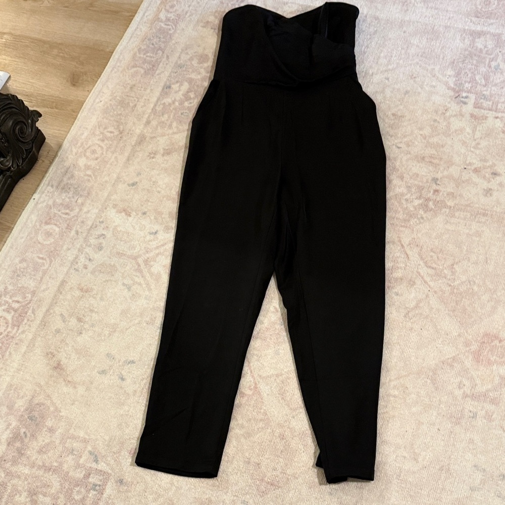 Woman’s strapless, black jumpsuit , elastic panel on back with pockets